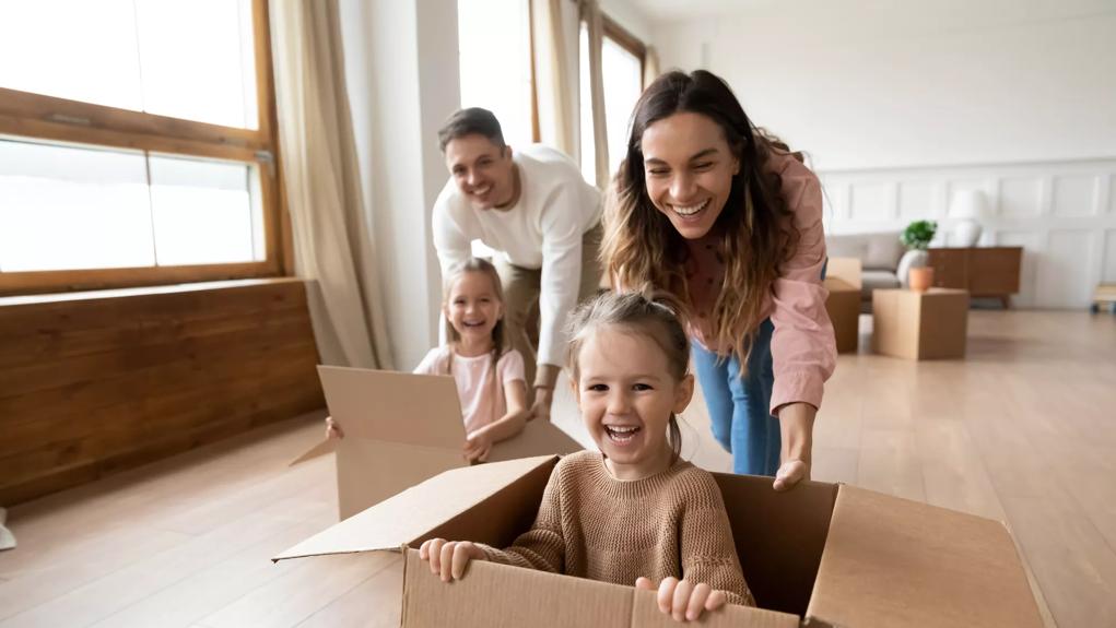 parents playing with children on moving day