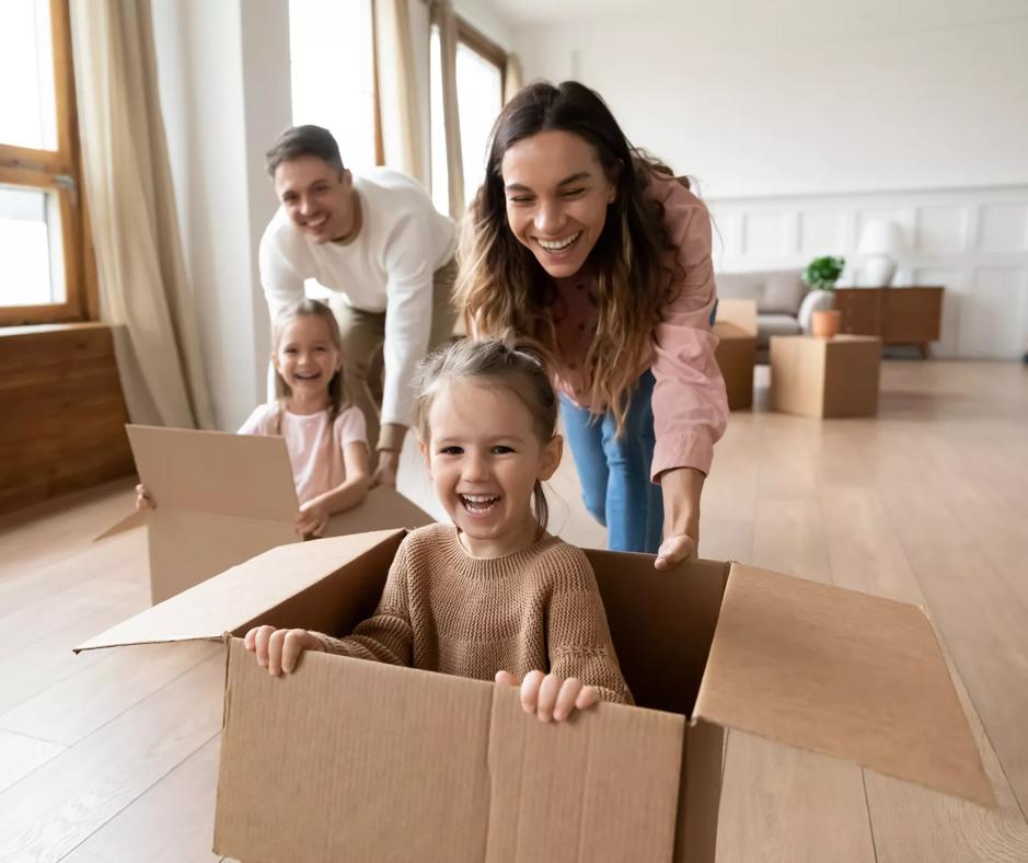 parents playing with children on moving day